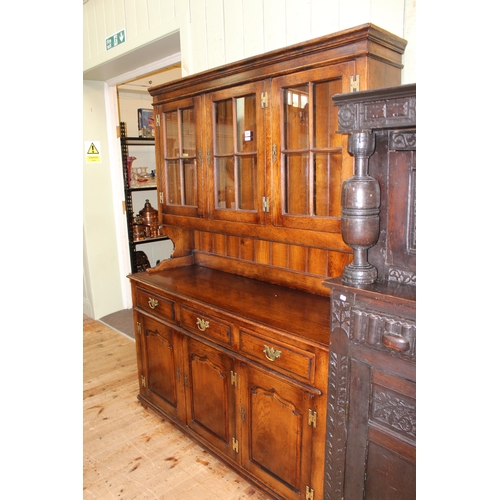 405 - Oak dresser having three glazed panel cupboard doors above a base of three drawers with three fielde... 