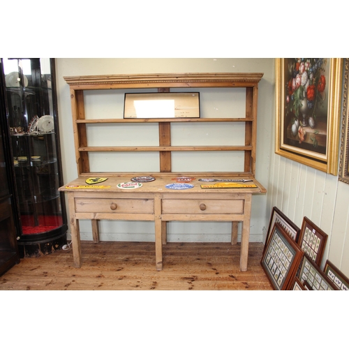 407 - Two drawer pine dresser and associated Delft rack, 181cm by 180cm by 67cm.