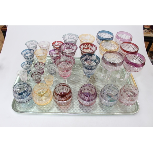 5 - Suite of coloured crystal glasses and six hock glasses.