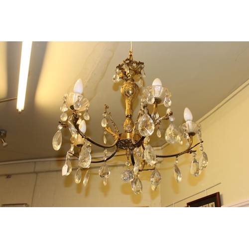 88 - Ornate gilt metal five branch ceiling light with glass lustre drops.