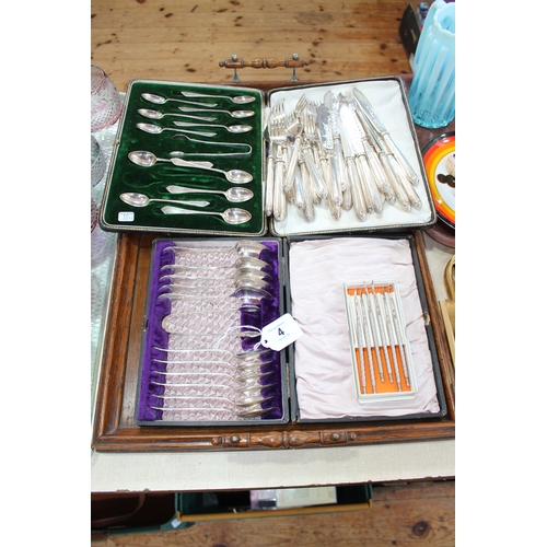 4 - Two cased sets of EP teaspoons, fish eaters and lobster picks.