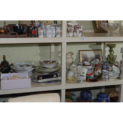 105 - Full shelf of glass, china, pewter, copper and brass graduated pans, table lamps, seashells, etc.