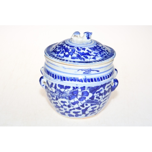 161 - Chinese blue and white lidded pot with side lug handles, 18.5cm high.