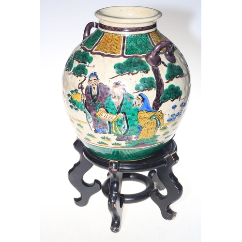 176 - Large Chinese vase with figure decoration, 30cm, with wood stand.