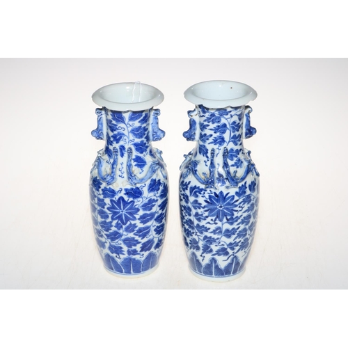 184 - Pair of Chinese blue and white vases with raised Lizard design.