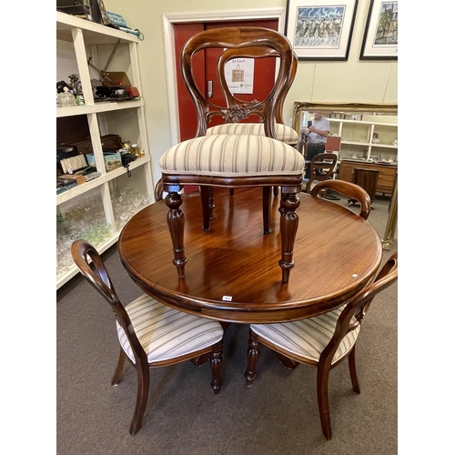 364 - Circular mahogany pedestal dining table and set of six balloon back dining chairs.