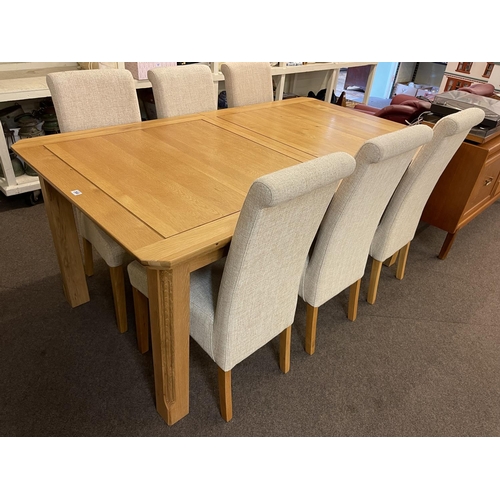 366 - Rectangular light oak extending dining table with integral leaf and six dining chairs.