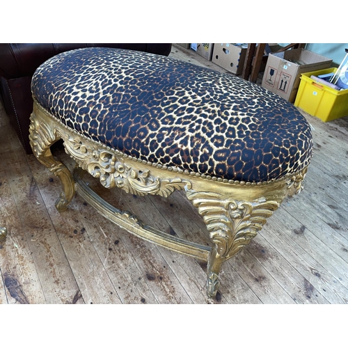 381 - Large gilt framed oval stool in leopard skin print fabric.