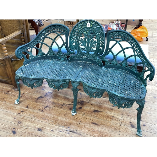 384 - Green cast metal garden bench with shaped front seat, 138cm.