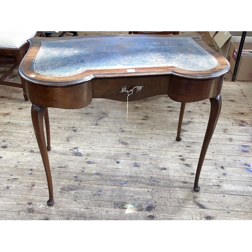 400 - Mahogany ladies writing table of shaped form on cabriole legs, 73cm by 92cm by 54cm.