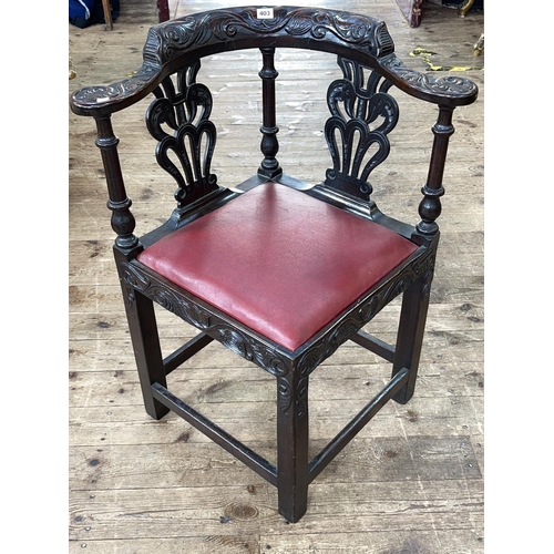 403 - Victorian carved oak corner elbow chair.