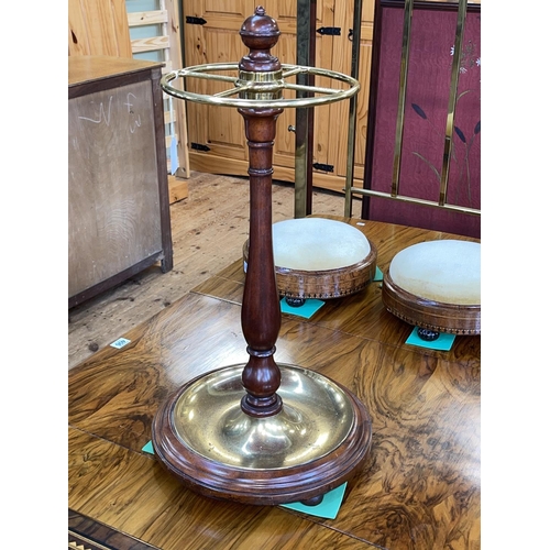 405 - Brass and hardwood revolving stick stand, 61cm.