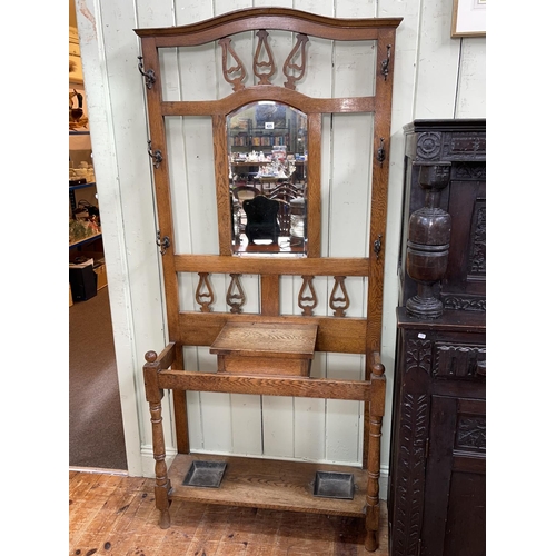 425 - Arts & Crafts oak mirror backed hallstand, 201cm by 90cm by 30.5cm.