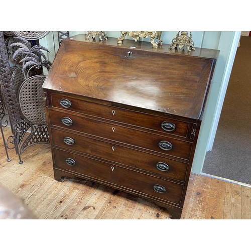 427 - Georgian mahogany four drawer bureau with well fitted interior, 104cm by 101cm by 51cm.