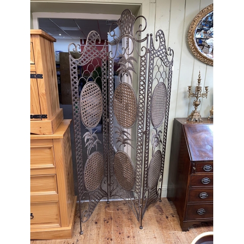 428 - Wrought iron and cane panelled three fold screen, 201cm.