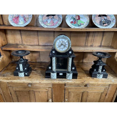 148 - Three piece Slate and marble clock garniture set, clock 49cm.