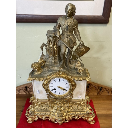 149 - Ornate gilt metal and marble mantel clock with a Centurion mounted top, 57cm high.