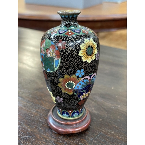 160 - Small floral decorated cloisonné vase on stand, 12cm high.