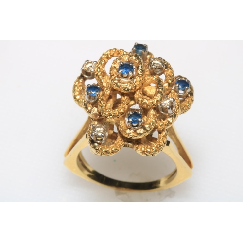 181 - Diamond and sapphire fancy cluster 18k gold ring, size P/Q.