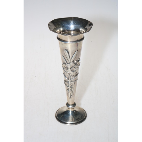 250 - William Comyns silver embossed spill vase, 21cm.