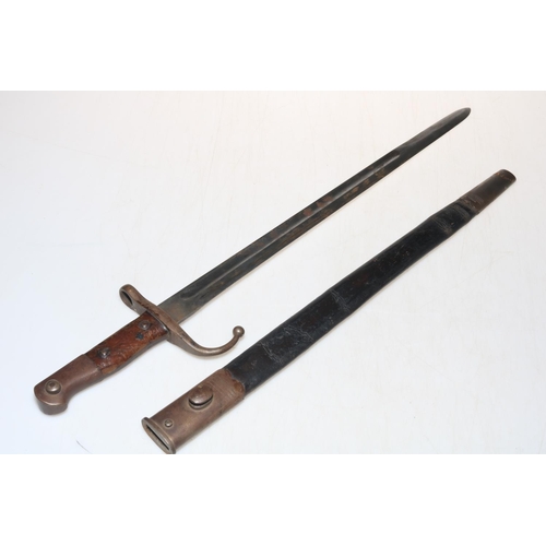 282 - Middle Eastern bayonet with scabbard, blade 46cm length.