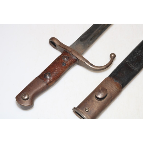 282 - Middle Eastern bayonet with scabbard, blade 46cm length.