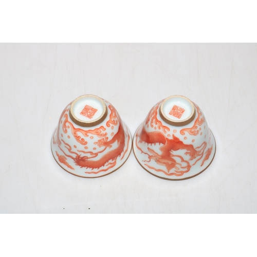 170 - Pair Chinese iron red dragon tea bowls.