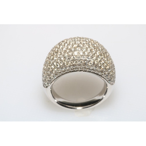 204 - 18 carat white gold and diamond bombé ring, diamond total 3.60 carat, size N.