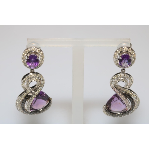 205 - Impressive amethyst jewellery pendant and earrings in 18 carat white gold.