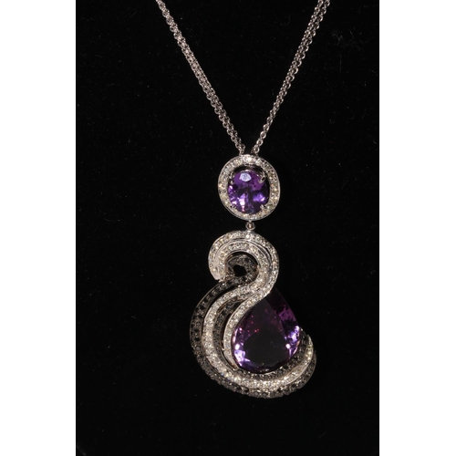 205 - Impressive amethyst jewellery pendant and earrings in 18 carat white gold.