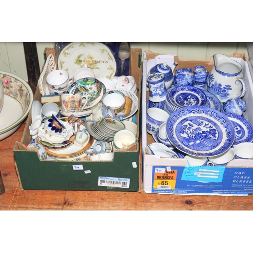 34 - Five boxes of mostly decorative china with jugs, blue and white, figures and toilet jug and basin.