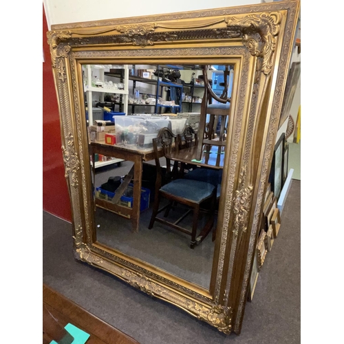 400 - Large gilt framed rectangular bevelled wall mirror, 157cm by 127cm overall.