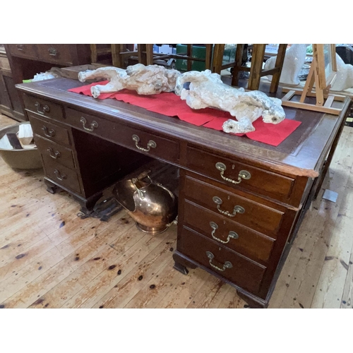 407 - Mahogany nine drawer pedestal office desk on ogee bracket feet, 77cm by 167cm by 106cm.