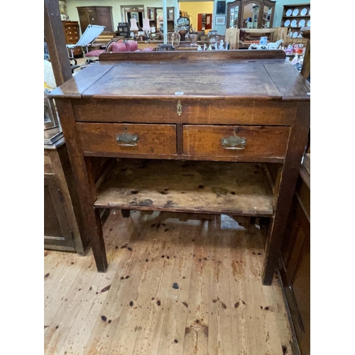 408 - Victorian pitch pine two drawer clerks desk, 120cm by 106cm by 63cm.