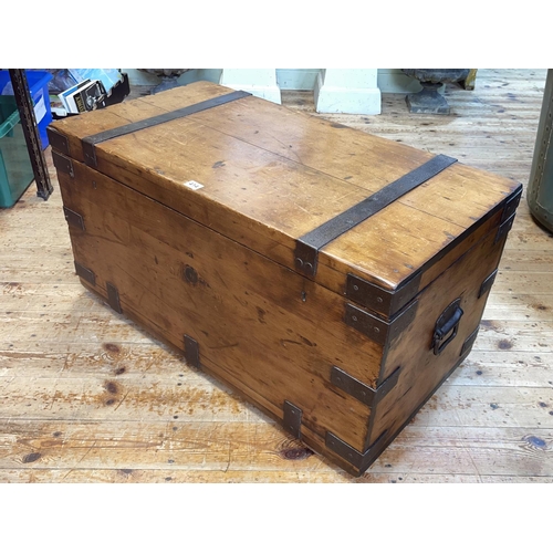 414 - Pine and iron bound trunk, 45cm by 87cm by 47cm.