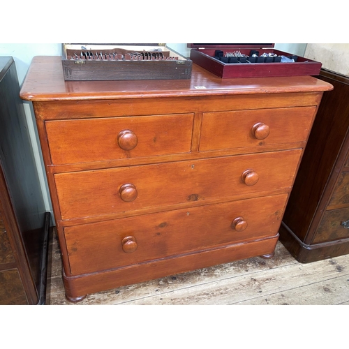 431 - Painted pine chest of two short above two long drawers on bun feet, 80cm by 96cm by 50cm.