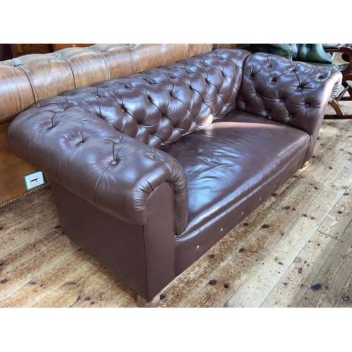 436 - Brown buttoned leather drop end Chesterfield settee.