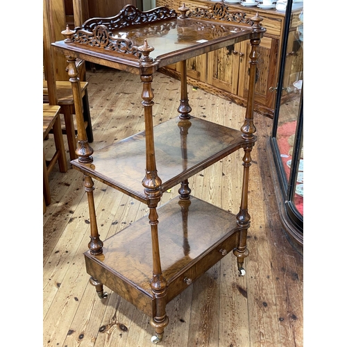 448 - Victorian walnut three tier etagere with fretwork 3/4 gallery top and base drawer, 114cm by 61cm by ... 