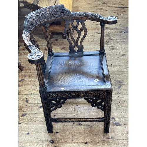 455 - Victorian carved oak corner elbow chair.