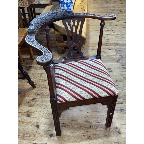 457 - Victorian carved mahogany corner elbow chair.