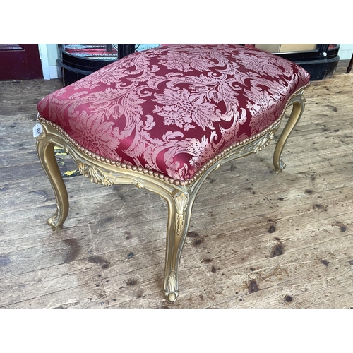 458 - Large gilt framed stool of serpentine form, 62cm by 110cm by 65cm.