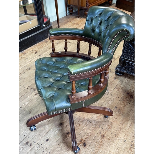 462 - Green deep buttoned leather Captains style swivel desk chair.