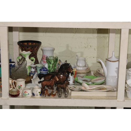 89 - Full shelf of glass, china, teaware, animal ornaments, family bible, pictures, wall clock, etc.