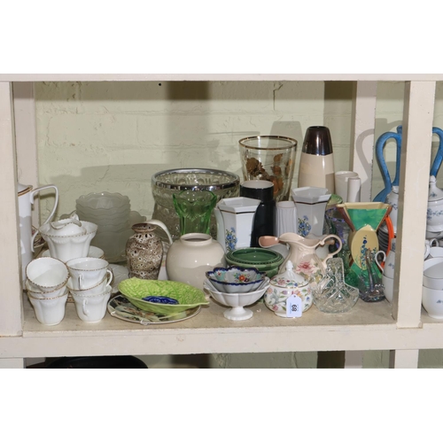 89 - Full shelf of glass, china, teaware, animal ornaments, family bible, pictures, wall clock, etc.