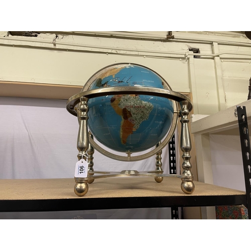 106 - Terrestrial globe on brass stand, approximately 55cm high.