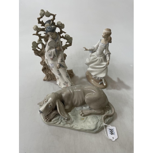 266 - Two Lladro lady figures and Nao dog (3).