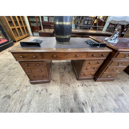 422 - Victorian mahogany nine drawer pedestal desk, 73cm by 138cm by 72cm.