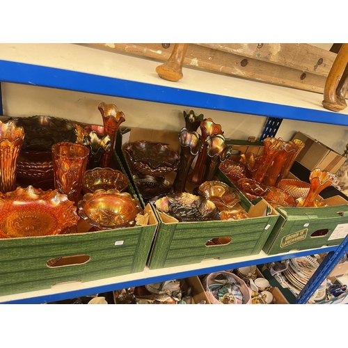 69 - Four boxes of Carnival glass including vases, large bowls, etc.