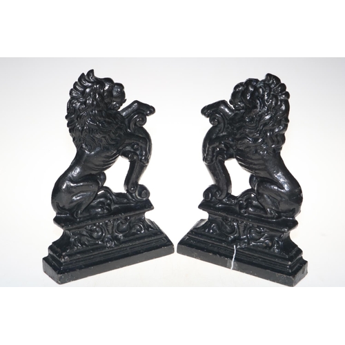 136 - Pair of cast iron lion doorstops, 36cm high.