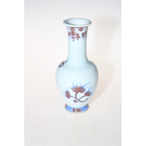 166 - Chinese dragon vase in underglaze blue and iron red, six character mark, 20cm.